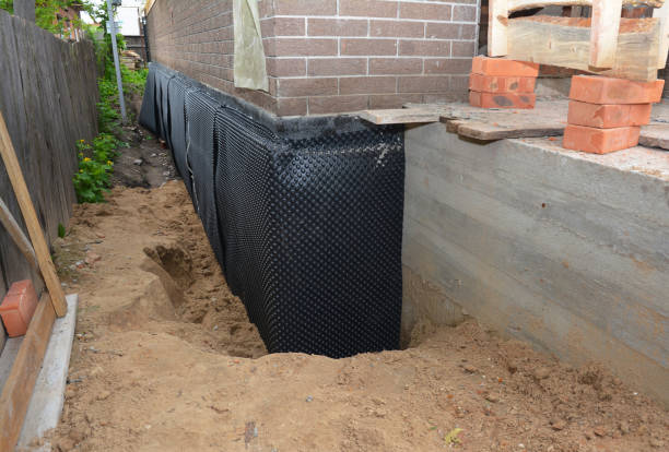 Happy homeowners after waterproofing job in Advance